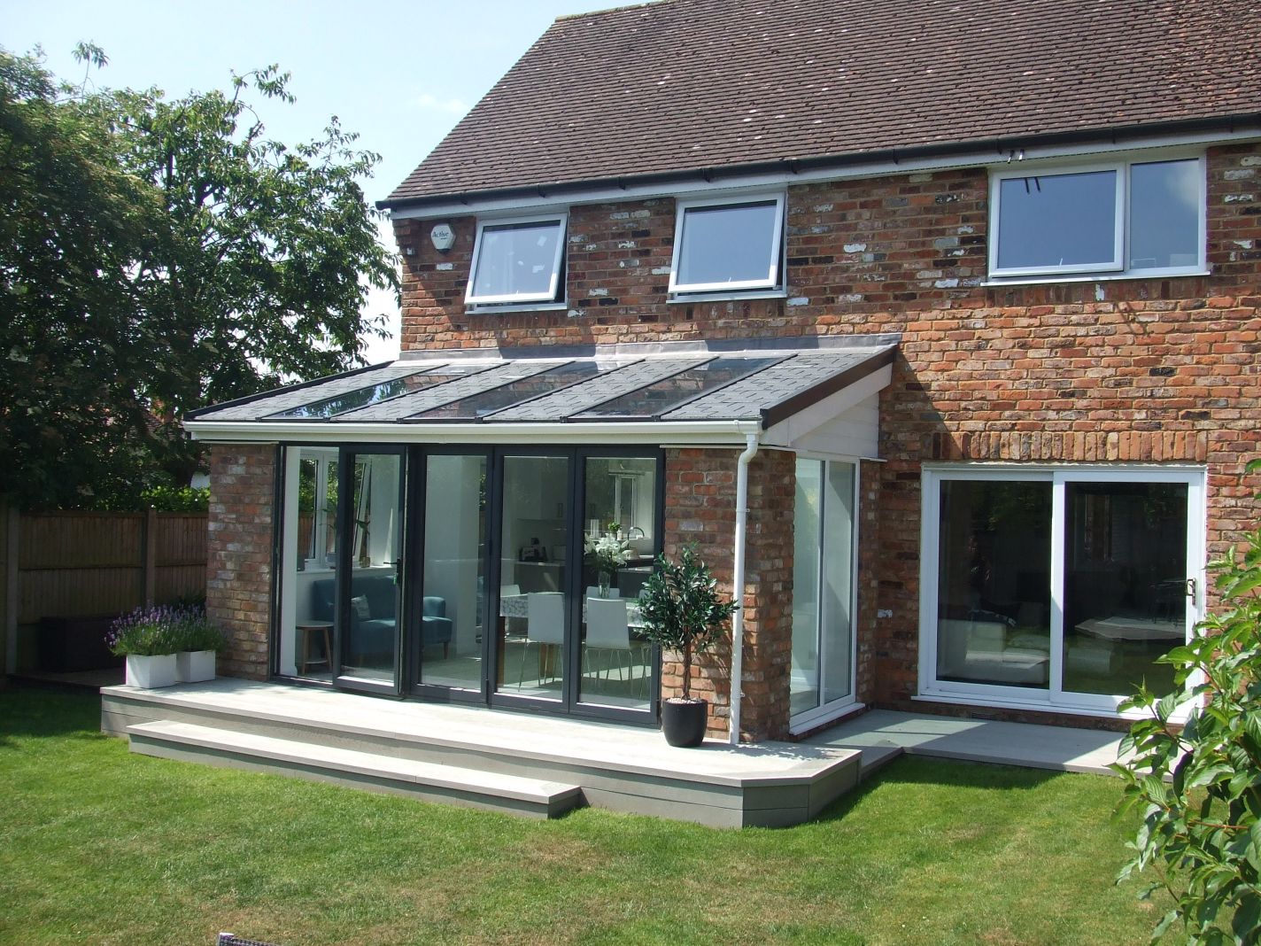 large conservatories Windsor example - conservatory on rear of home with steps out to garden