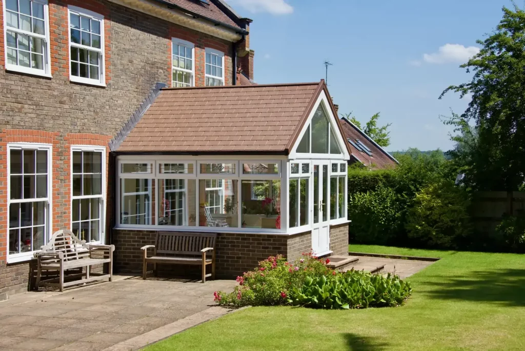 red brick gable front end conservatory with the garden view